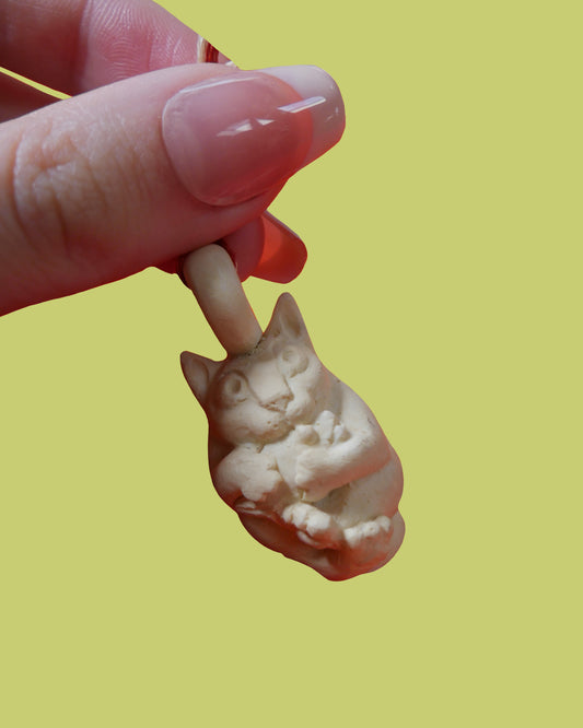 A hanging Cat charm 